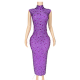A sexy long dress with new style that is not transparent full of diamonds. It has a sleeveless and buttocks wrapped around the waist