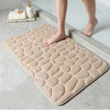 The bathroom is a soft and comfortable viscoelastic carpet with pebble relief, quick water absorption, washable, non slip, 1 piece