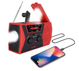 Solar powered hand charging NOAA radio with flashlight reading light in the United States