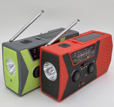 Solar powered hand charging NOAA radio with flashlight reading light in the United States