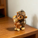 3D Resin Monkey Keyring Charm Pendant Lightweight Cute Monkey Holding Plush Pendant for Women Girls Backpack Purse Car Keys
