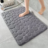 The bathroom is a soft and comfortable viscoelastic carpet with pebble relief, quick water absorption, washable, non slip, 1 piece